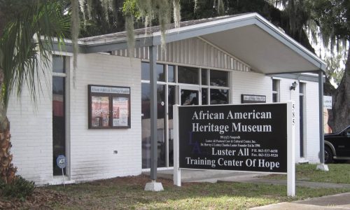 Exterior of entrance and sign at African American Heritage Museum and Luster All Training Center of Hope in Bartow, FL