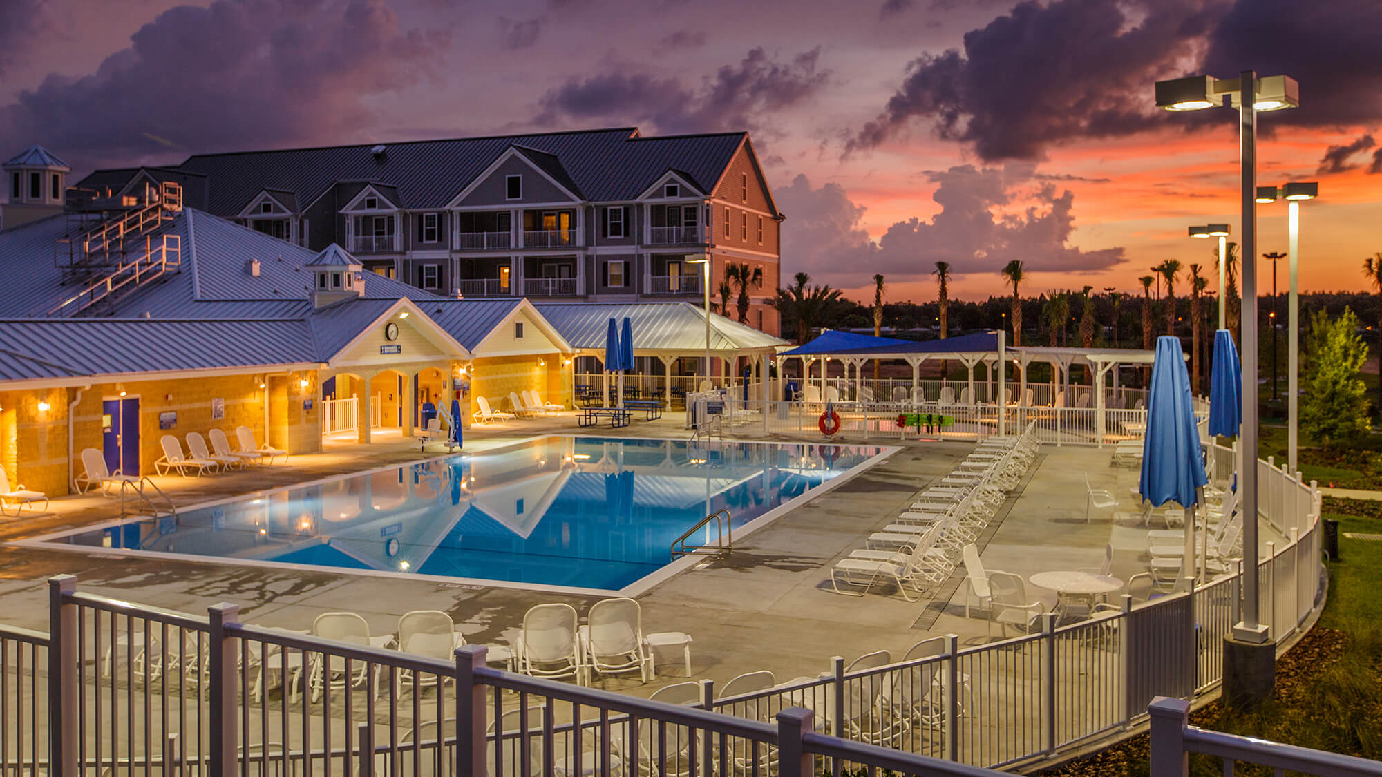 Pool, pool deck and exterior of Holiday Inn Club Vacations Orlando Breeze Resort in Davenport, FL