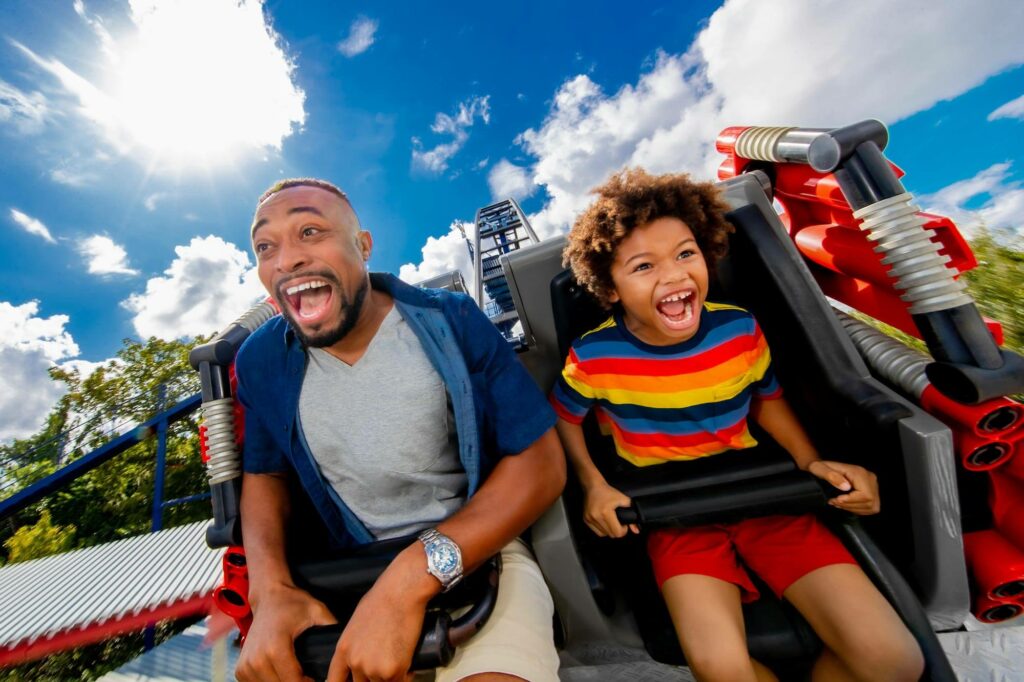 father and son on Great LEGO Race roller coaster at LEGOLAND in Winter Haven, FL