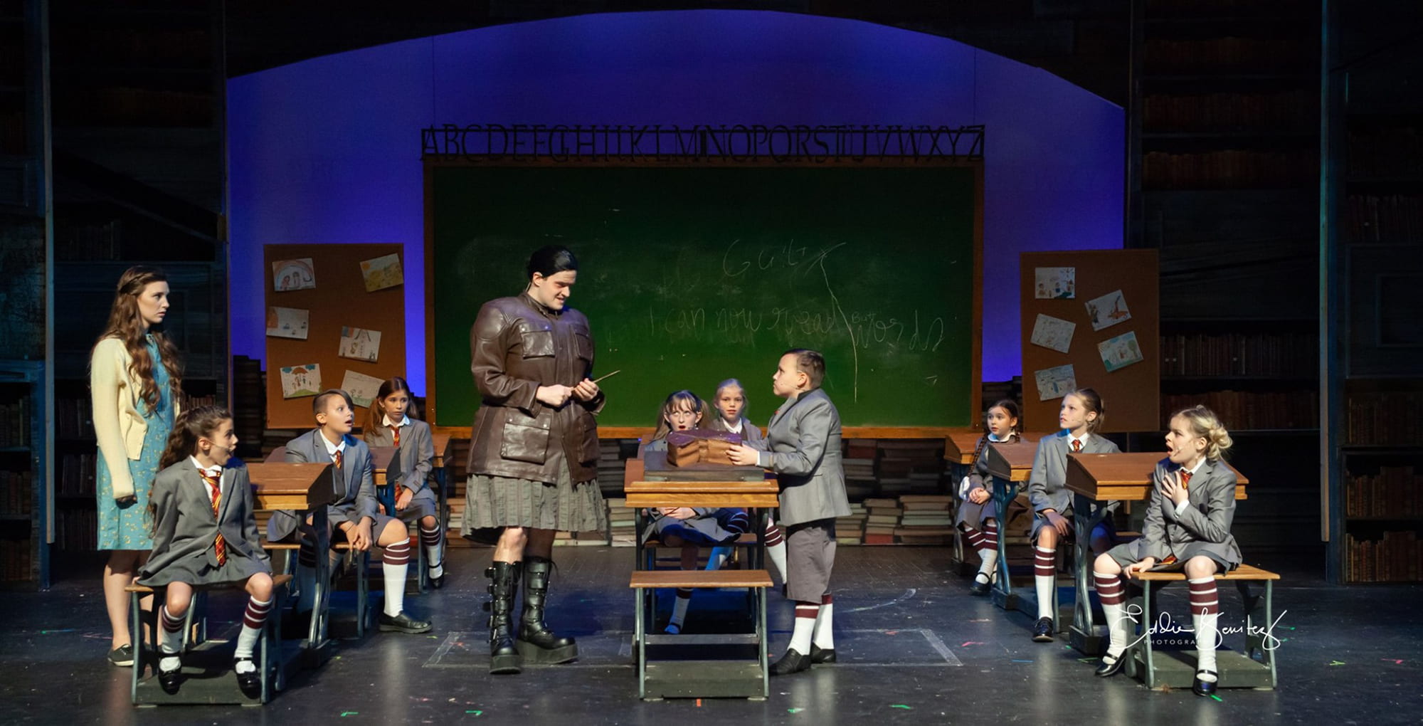 Actors on stage during a performance of Matilda at Lakeland Community Theatre.