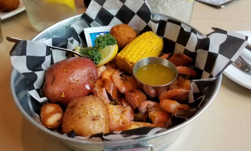 potatoes, corn on the cob, shrimp and butter. Seafood boil bowl at Harry's Old Place in Winter Have, FL