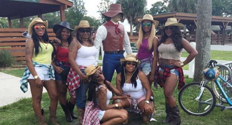 7 women around cowboy statue during a Girls Weekend at Westgate River Ranch IG: Gorgeousdee11