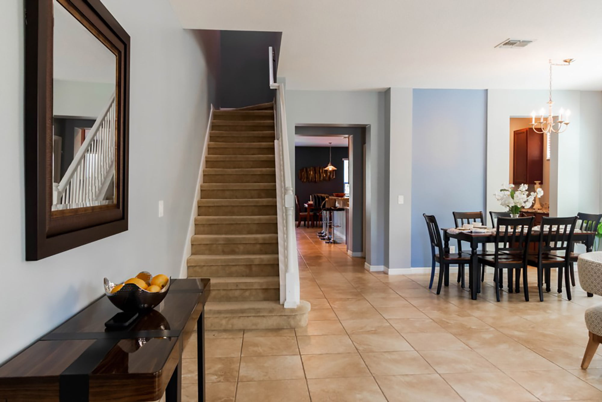 entryway stairs, and dining area of home managed by JC Vacation Homes
