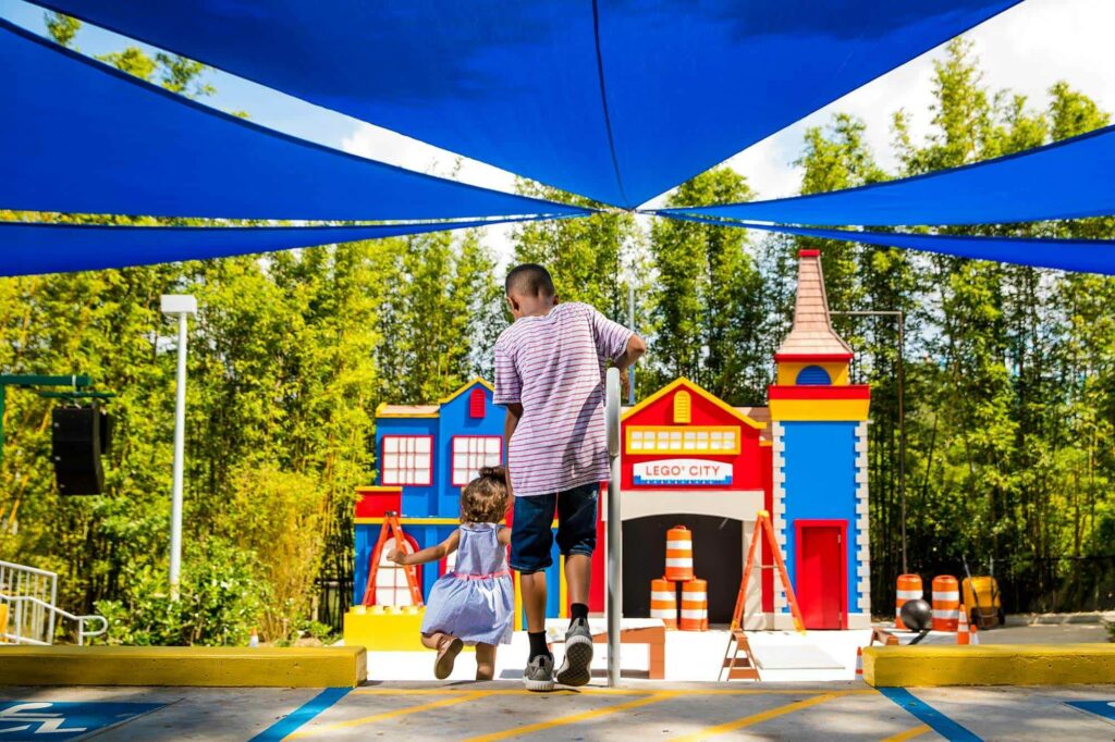 young boy and toddler entering LEGO City Stage Show at LEGOLAND Florida