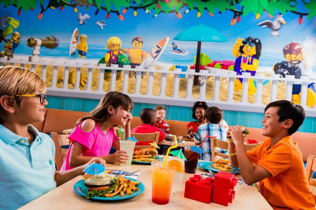 kids eating inside Sandy's Castle Restaurant at LEGOLAND Beach Retreat